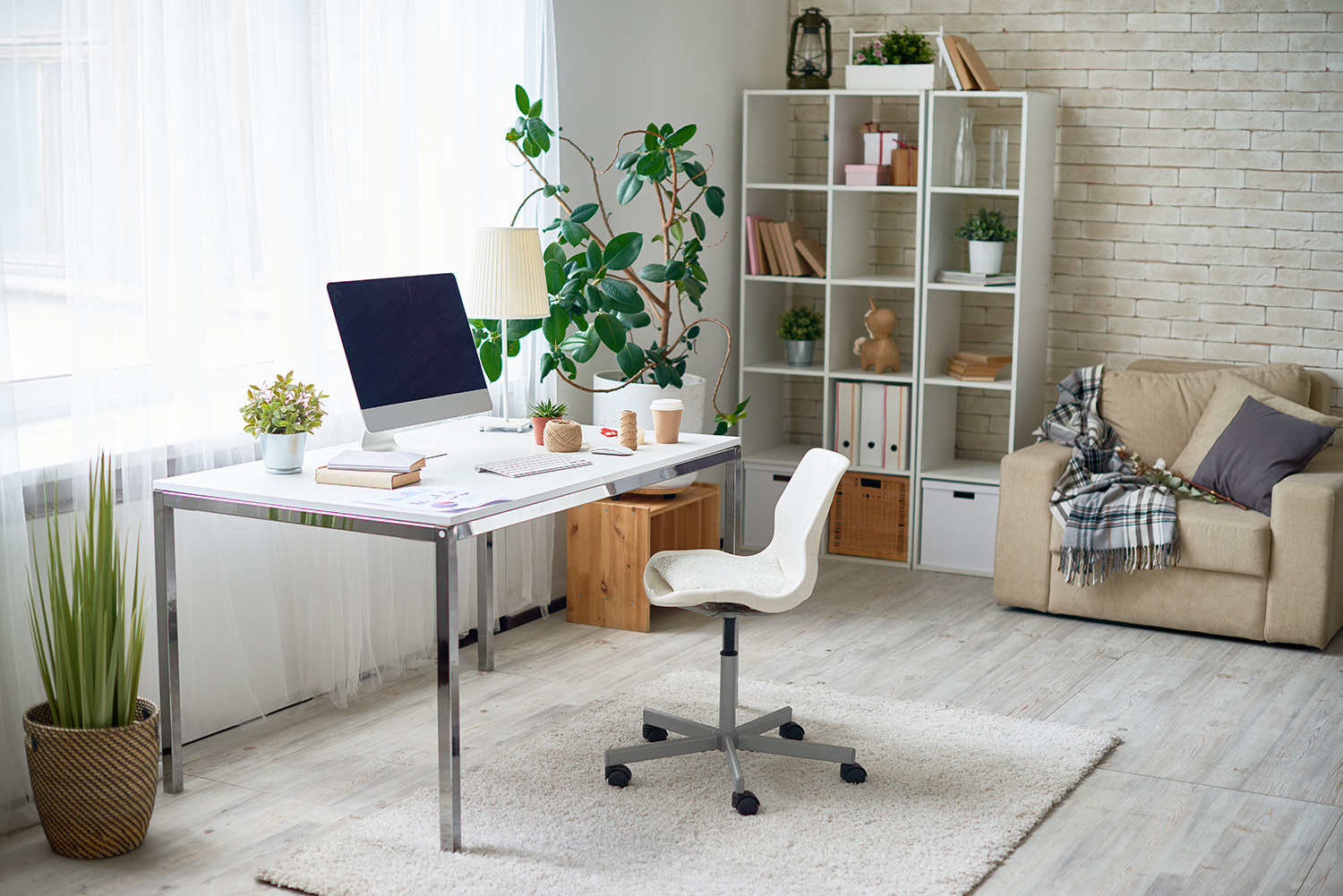 An image of modern home office with white chair and iMac